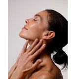 Model smoothing Dr Hauschka Regenerating Night Serum Intensive onto her neck