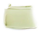 Close-up of a pale green Dr Hauschka Revitalising Mask smear, spread into a broad rectangle with a smooth centre and curled edges.