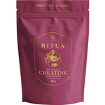 A maroon pouch labeled "Ritua Creatine Monohydrate Strength For Women" with gold text and a female athlete illustration emphasizes muscle recovery and strength, and contains 300 grams.
