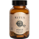 Amber bottle of Ritua Focus Ginko, Cordyceps, Tyrosine & B6 cognitive support supplement with black lid. Label shows an eye and highlights Bacopa, Ginkgo, Cordyceps, Tyrosine, and Vitamin B6 for memory. Contains 60 capsules.