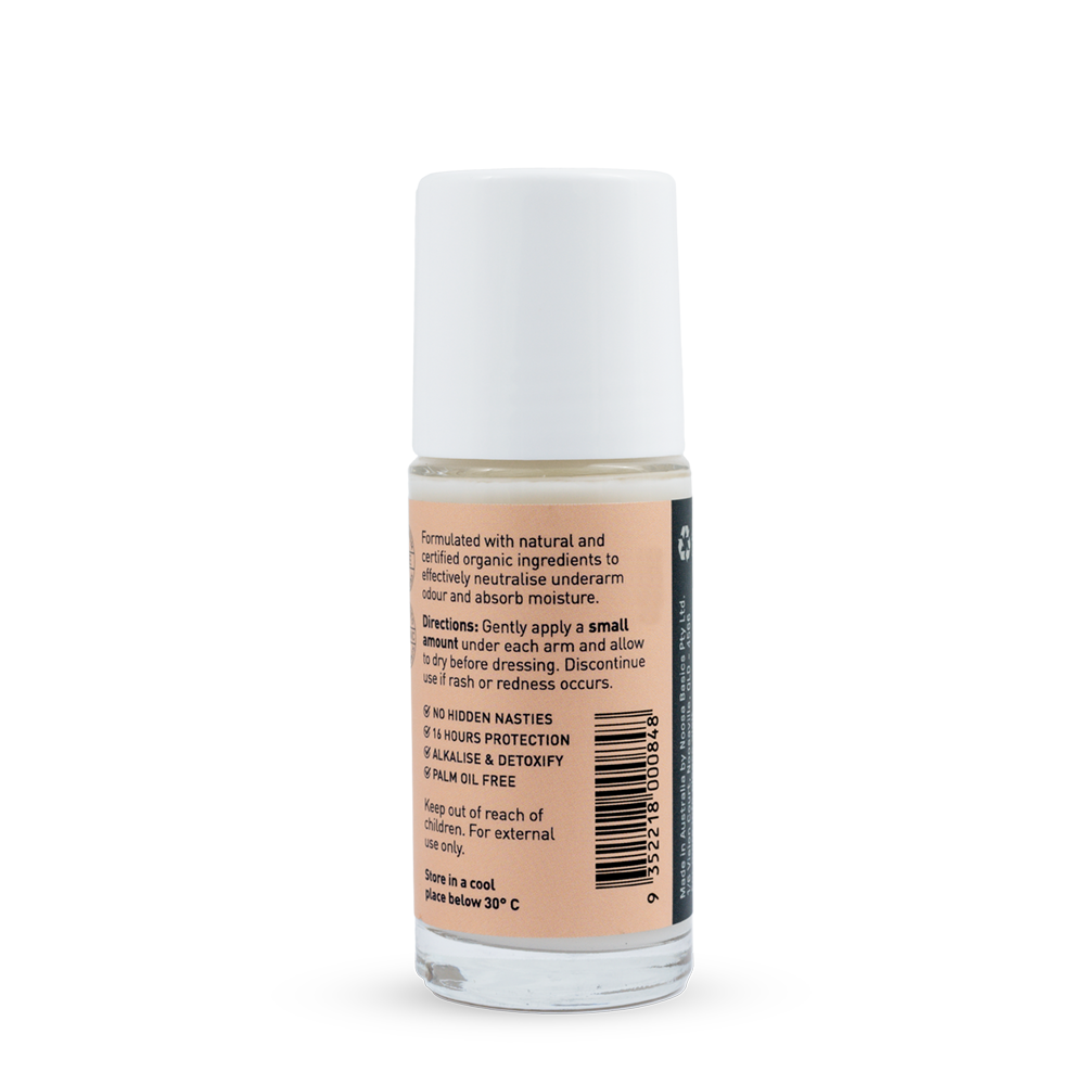 Back of a clear Noosa Basics Coconut and Vanilla roll-on deodorant bottle with a white cap, showing small black directions and product information beside a barcode on its peach label.