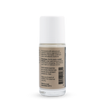 Back of a clear Noosa Basics Coconut roll-on deodorant bottle with a white cap, showing small black directions and product information beside a barcode on its beige label.