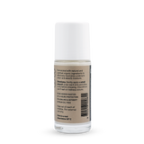 Back of a clear Noosa Basics Coconut roll-on deodorant bottle with a white cap, showing small black directions and product information beside a barcode on its beige label.