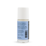 Back of a clear Noosa Basics Sweet Orange and Lavender roll-on deodorant bottle with a white cap, showing small black directions and product information beside a barcode on its pale blue label.