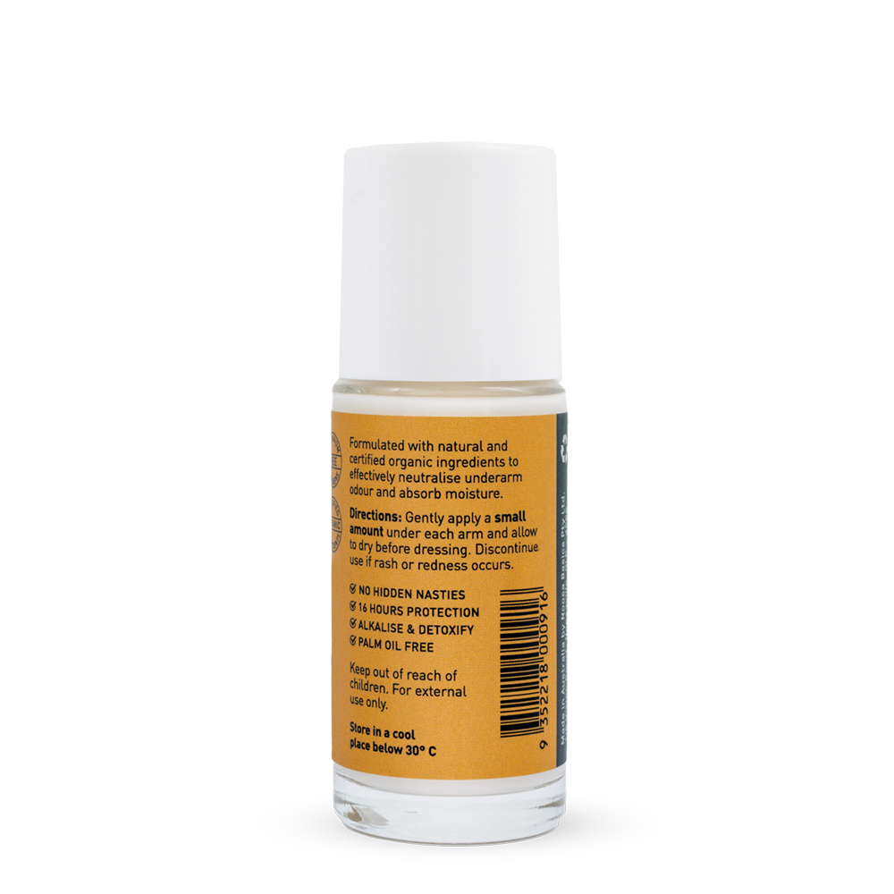 Back of a clear Noosa Basics Sandalwood roll-on deodorant bottle with a white cap, showing small black directions and product information beside a barcode on its orange label.