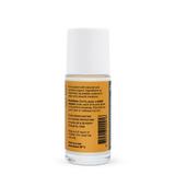 Back of a clear Noosa Basics Sandalwood roll-on deodorant bottle with a white cap, showing small black directions and product information beside a barcode on its orange label.