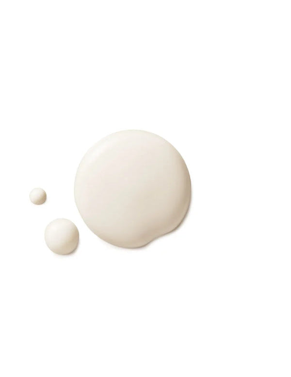 Three smooth milky-white Dr Hauschka Rose Deodorant drops on white, with one large oval drop and two smaller round drops beside it.