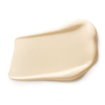 Close-up of a thick ivory Dr Hauschka Rose Nurturing Body Cream smear shaped into a broad rectangle with high curved edges.