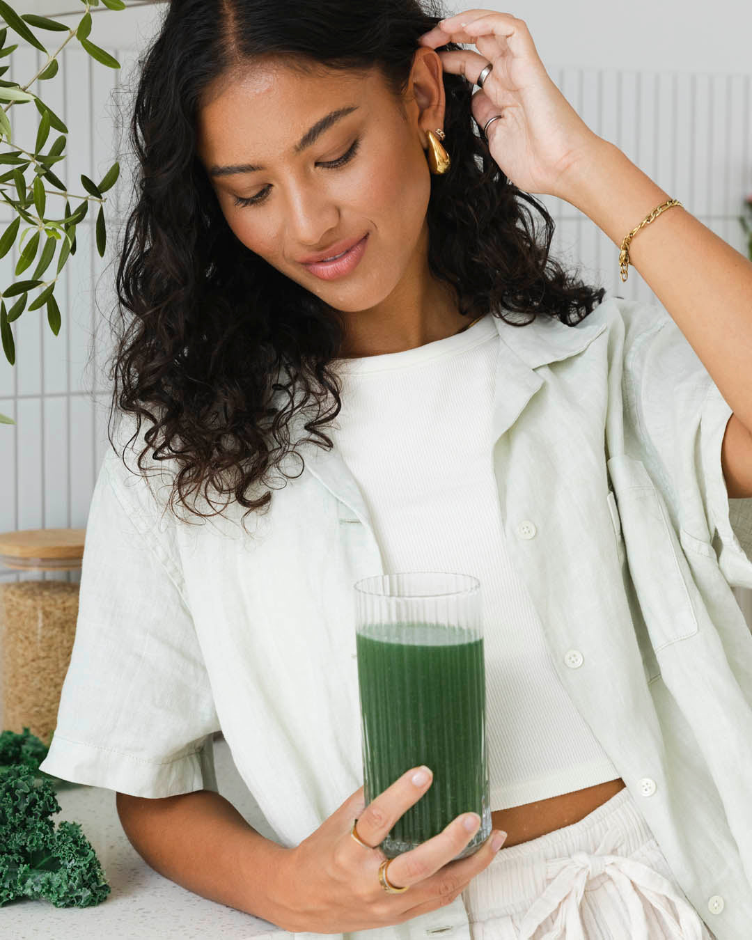 Woman enjoying Nutra Naturals Super Greens and Reds Watermelon Strawberry