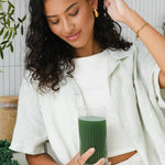 Woman enjoying Nutra Naturals Super Greens and Reds Watermelon Strawberry