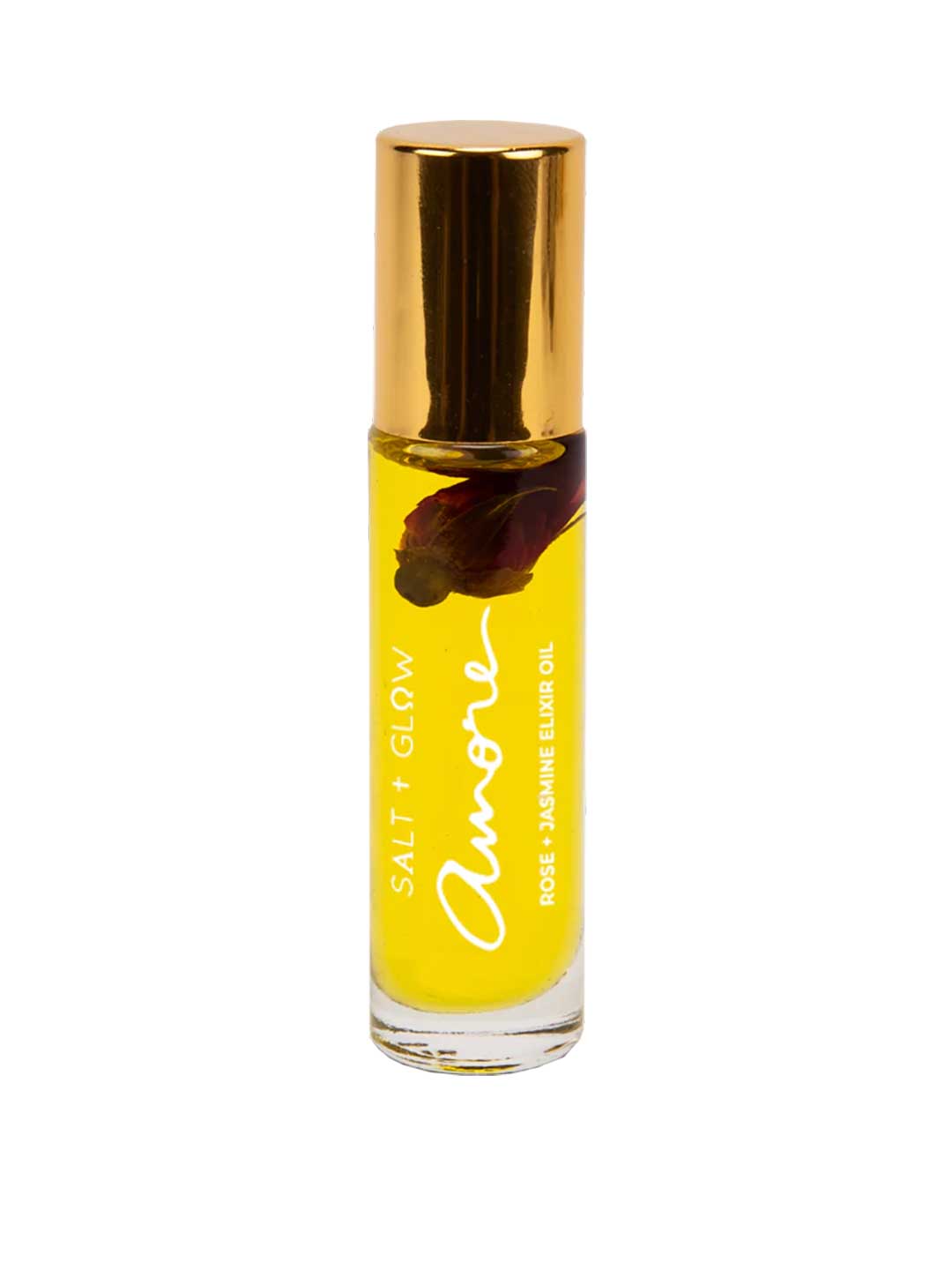 A clear glass bottle of Salt + Glow Elixir Roll on Perfume - Amore (Rose & Jasmine) 10ml, with yellow oil, a gold cap, and a dark flower petal inside. This handmade Australian floral perfume blends rose and jasmine notes.