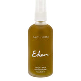 A 100ml clear bottle labeled "Salt + Glow Eden Cleansing Oil" with a white spray cap holds a nourishing hemp and kale blend, serving as an effective makeup remover.