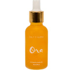 A yellow glass dropper bottle with a gold cap, labeled Salt + Glow Ora Ultimate Facial Oil 30ml—a superfood face oil for radiant, healthy skin.