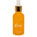 A yellow glass dropper bottle with a gold cap, labeled Salt + Glow Ora Ultimate Facial Oil 30ml—a superfood face oil for radiant, healthy skin.