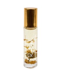 Salt + Glow Elixir Roll on Perfume - Restored (Frankincense & Chamomile) 10ml is a handmade vegan fragrance in a small clear bottle with gold flakes. Relaxing aromatherapy benefits come from soothing frankincense and chamomile oils.
