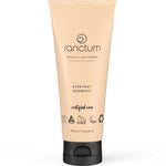A beige tube of Sanctum Everyday Shampoo 200g with a black flip cap, featuring eco-friendly, vegan, and cruelty-free certification logos.