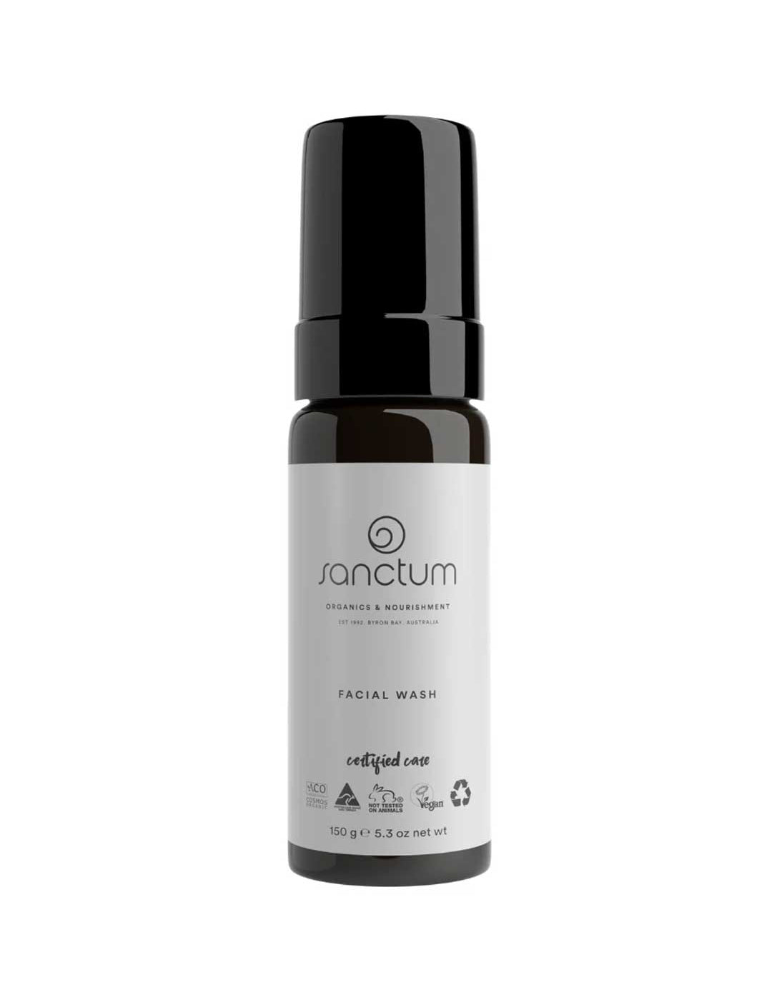 A black and white 150g bottle of Sanctum Men's Facial Wash with a pump dispenser. The label displays the Sanctum brand, product type, vegan and organic certifications, plus recycling symbols for this foaming cleanser.