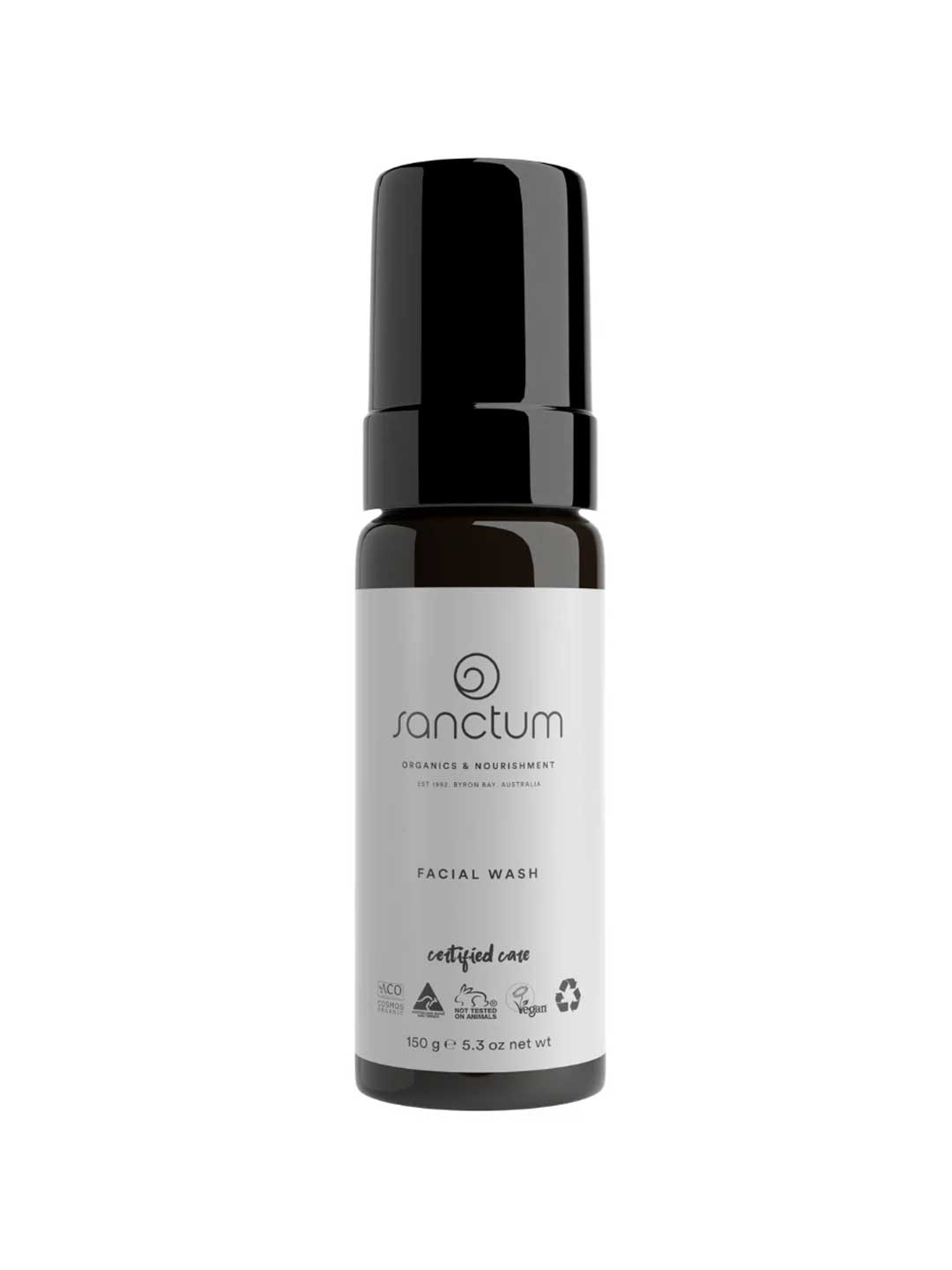 A black and white 150g bottle of Sanctum Men's Facial Wash with a pump dispenser. The label displays the Sanctum brand, product type, vegan and organic certifications, plus recycling symbols for this foaming cleanser.