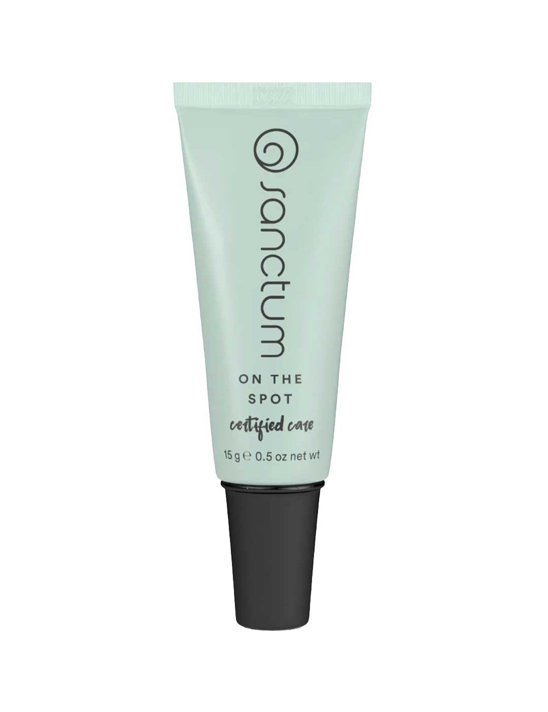 A light green tube of Sanctum On The Spot 15g with a black cap, featuring the Sanctum brand and product details printed vertically on the front. Contains 15g (0.5 oz) of natural blemish treatment.