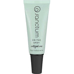 A light green tube of Sanctum On The Spot 15g with a black cap, featuring the Sanctum brand and product details printed vertically on the front. Contains 15g (0.5 oz) of natural blemish treatment.