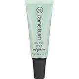 A light green tube of Sanctum On The Spot 15g with a black cap, featuring the Sanctum brand and product details printed vertically on the front. Contains 15g (0.5 oz) of natural blemish treatment.