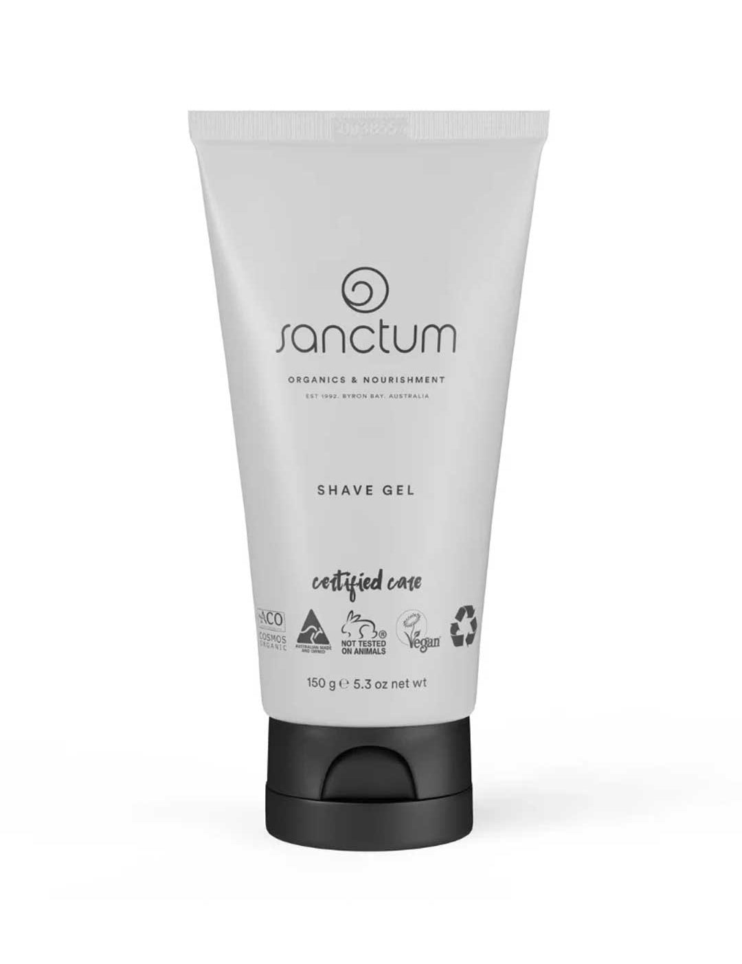 A 150g tube of Sanctum Shave Gel features a white design with a black flip-top cap, and displays its organic, vegan, and eco-friendly certifications on the packaging.