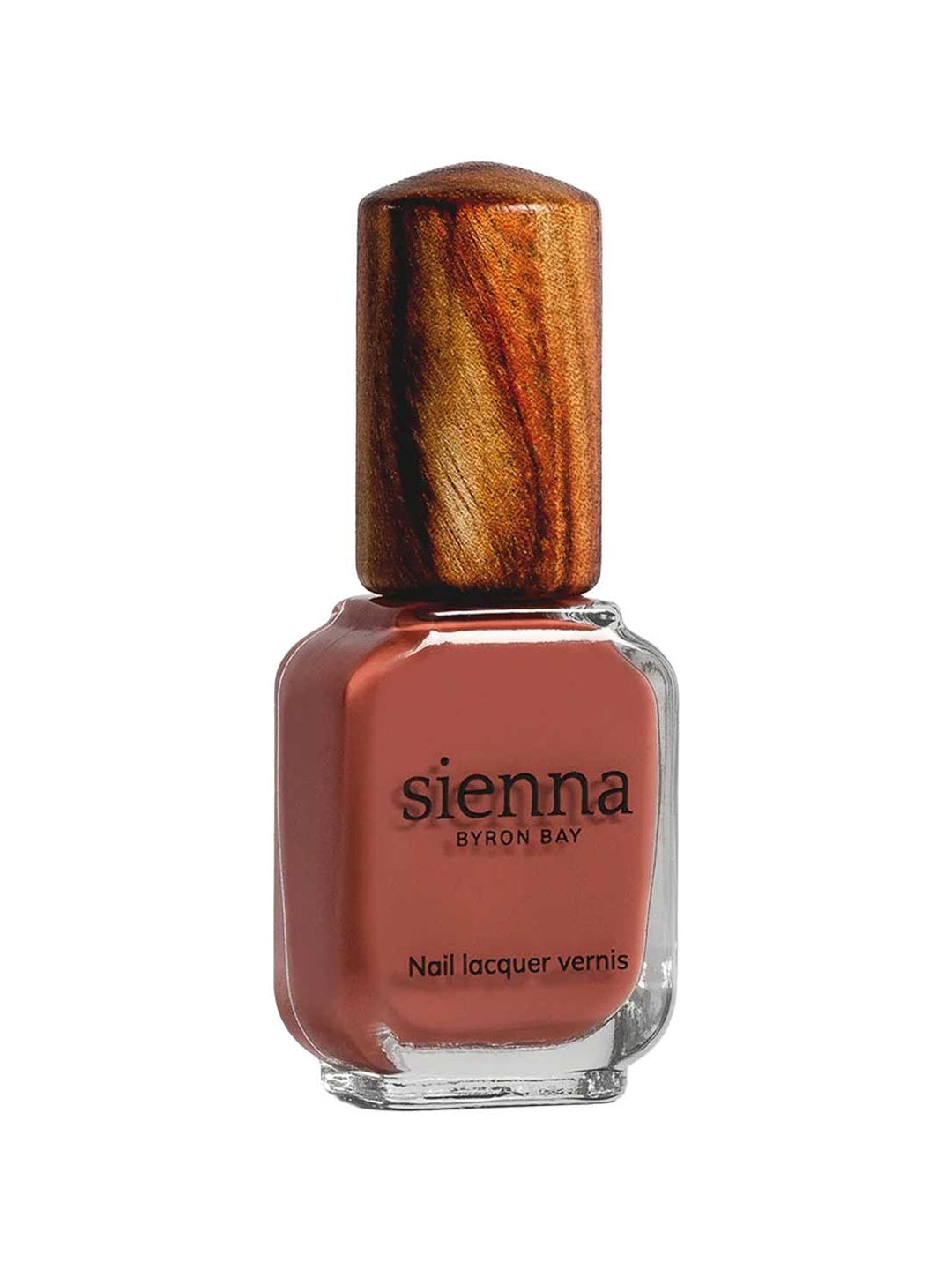 Clear rectangular Sienna Byron Bay Life nail-polish bottle filled with muted terracotta-red polish, with black lettering and a tall wood-grain cap.