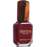 A bottle of Sienna Byron Bay Nail Polish in the shade Promise, featuring a clear glass base, wooden-textured cap, and a gold label with the brand name and product details.