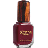 A bottle of Sienna Byron Bay Nail Polish in the shade Promise, featuring a clear glass base, wooden-textured cap, and a gold label with the brand name and product details.