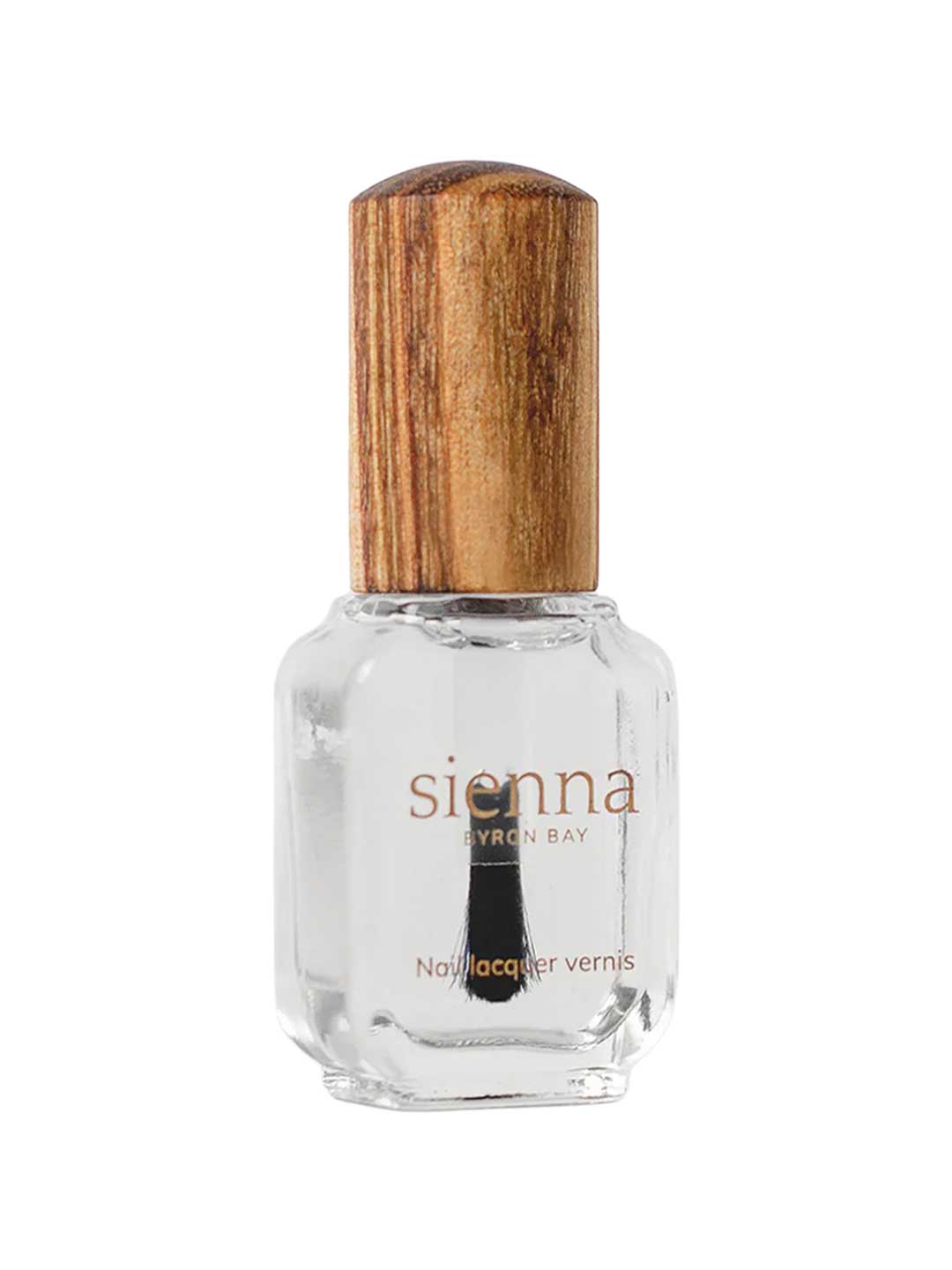 A clear glass bottle of Sienna Byron Bay Glossy Top Coat with a natural wooden cap, photographed on a white background.