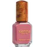 A bottle of Sienna Byron Bay - Blossom pink nail lacquer, featuring a wooden cap and gold lettering on the label, set against a white background.