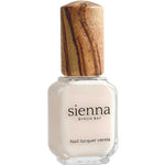 A bottle of Sienna Byron Bay - Hope nail lacquer with off-white polish, a wooden cap, and labeled "Nail Lacquer Vernis" from Sienna Byron Bay.