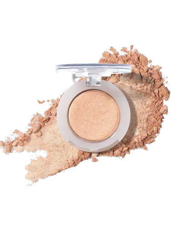 The 100% Pure Fruit Pigmented® Eye Shadow 2g by 100% Pure, a shimmery beige pressed powder, sits elegantly with a hint of scattered powder on a white background.