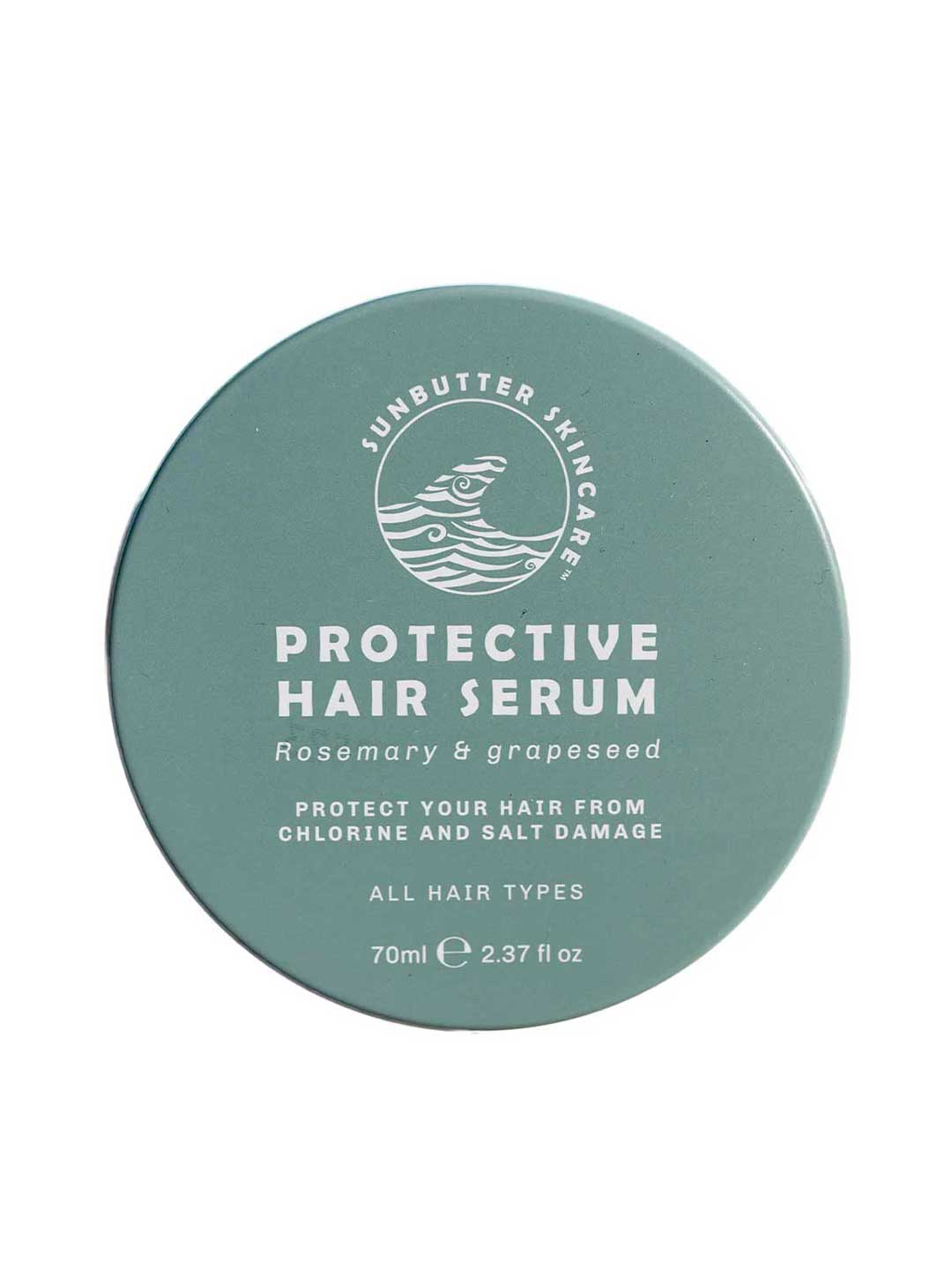 A round teal container of SunButter Skincare Protective Hair Serum 70ml for all hair types, with rosemary oil and grapeseed, shields hair from chlorine and salt damage.