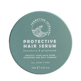 A round teal container of SunButter Skincare Protective Hair Serum 70ml for all hair types, with rosemary oil and grapeseed, shields hair from chlorine and salt damage.