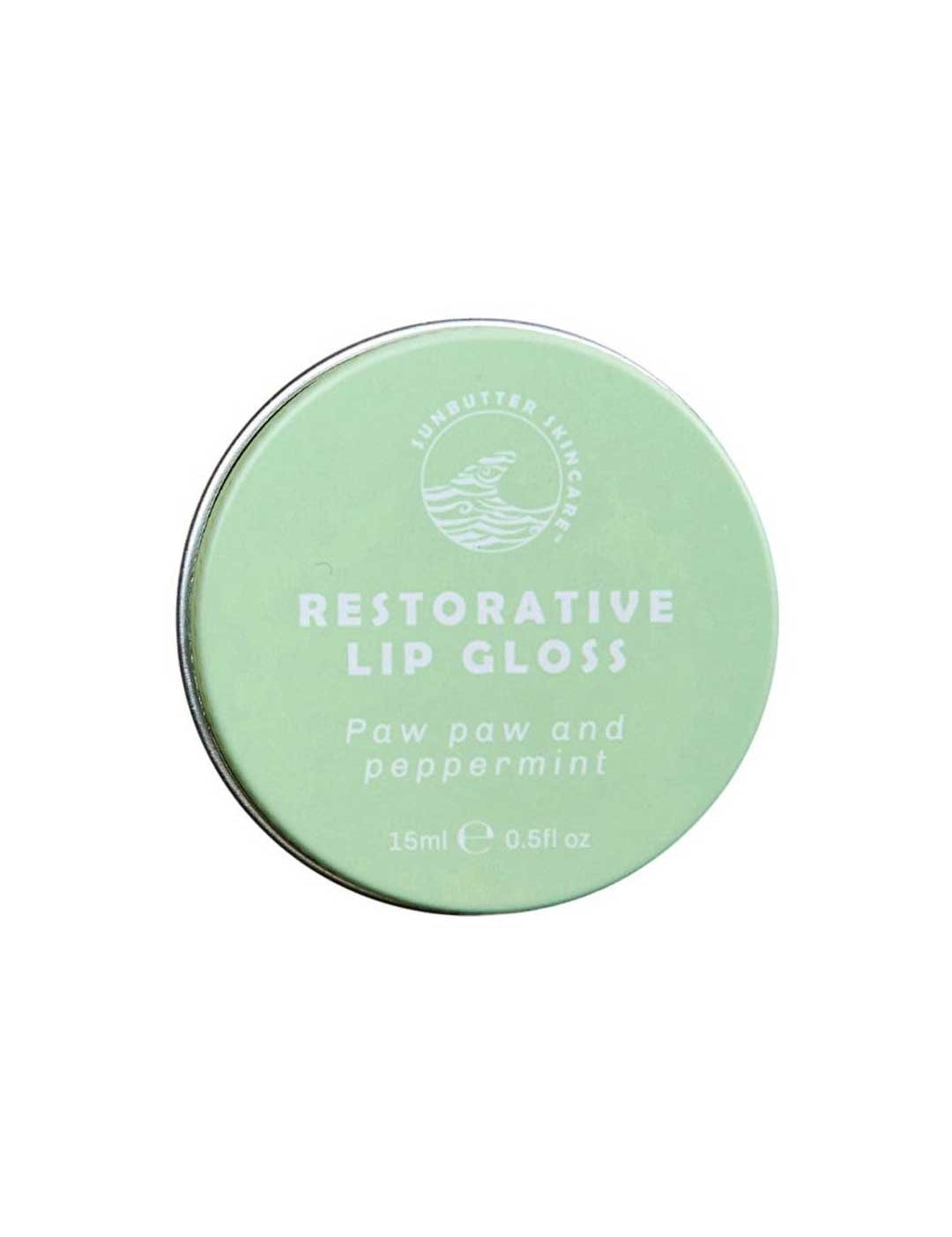 The SunButter Skincare Restorative Lip Gloss 15ml comes in a round, light green tin with the brand’s logo. This vegan lip balm blends paw paw and peppermint for soothing, hydrating lip care.