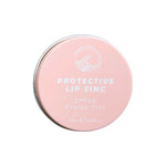 A round, pink tin labeled SunButter Skincare SPF15 Protective Lip Zinc - Protea Tint 15ml features a white logo and text. This 15ml reef-safe lip balm offers SPF15 zinc oxide protection with a natural rosy tint.