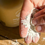 SunButter Deep Cleansing Powder in hand