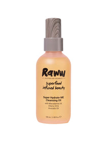 A 100ml Raww Hydrating Cleansing Oil in a beige frosted bottle with a wooden-textured cap, featuring macadamia, cherry, and avocado oils. Perfect for dry skin.