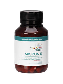 A brown plastic bottle labeled "Supercharged Food Love Your Gut Capsules Micron 5 90 Caps," featuring a white and teal label, contains superfine Australian diatomaceous earth capsules for gut health.