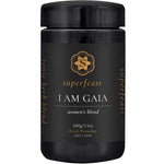 A black jar labeled Superfeast I Am Gaia 100g, with gold text and logo on a dark background—crafted as a tonic herbal blend designed to support women’s health.