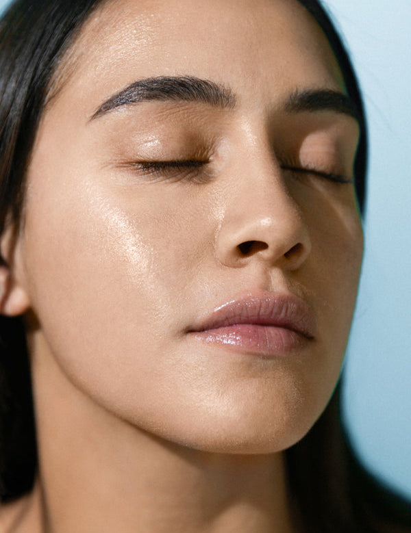 Model wearing Antipodes Supernatural SPF50+ Facial Sunscreen
