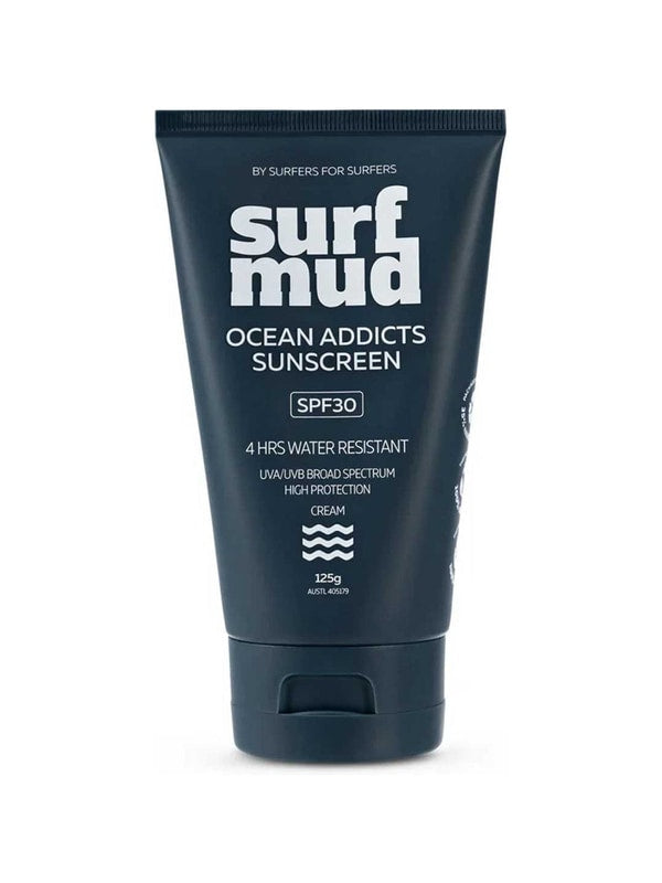 Dark navy Surfmud Ocean Addicts SPF30 sunscreen tube standing on its matching flip-top cap, with bold stacked white 'surf mud' lettering above the product details.