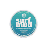 A round tin labeled "Surfmud Surfbaby Sensitive Sunscreen SPF30 Tin" offers water resistant, broad spectrum protection for sensitive skin in a 100g size, set against a teal background.