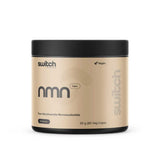 A beige and black container labeled Switch Nutrition NMN (Nicotinamide Mononucleotide) 60 caps. This vegan supplement supports healthy ageing and cellular energy, containing 60 vegetable capsules (30g) for 60 servings. Brand: Switch Nutrition.