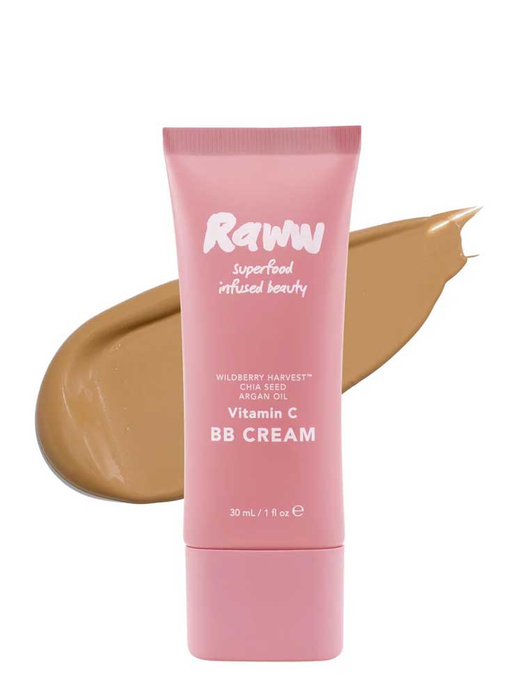 A pink tube of RAWW Vitamin C BB Cream 30ml stands before a tan smear, highlighting its shade. This hydrating balm helps deliver a luminous complexion.
