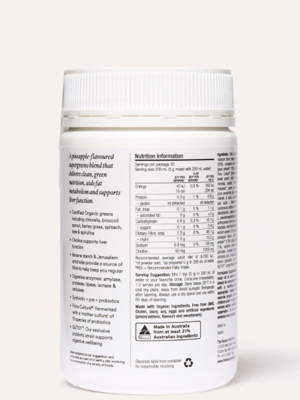 Rear view of the white The Beauty Chef Daily Supergreens Pineapple jar beneath its ribbed white lid, showing a nutrition table, serving instructions and product information in small black print.