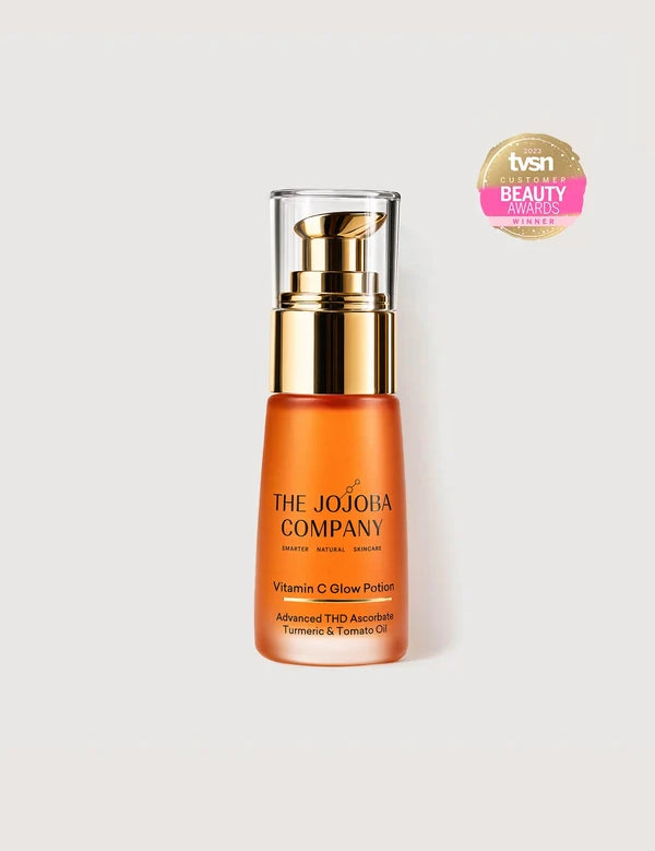 The Jojoba Company Vitamin C Glow Potion 30ml orange bottle with gold pump