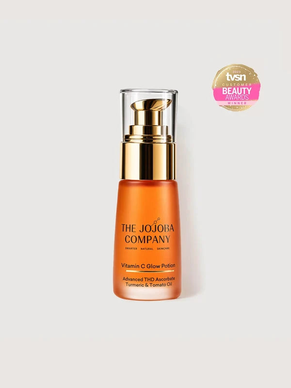 The Jojoba Company Vitamin C Glow Potion 30ml orange bottle with gold pump