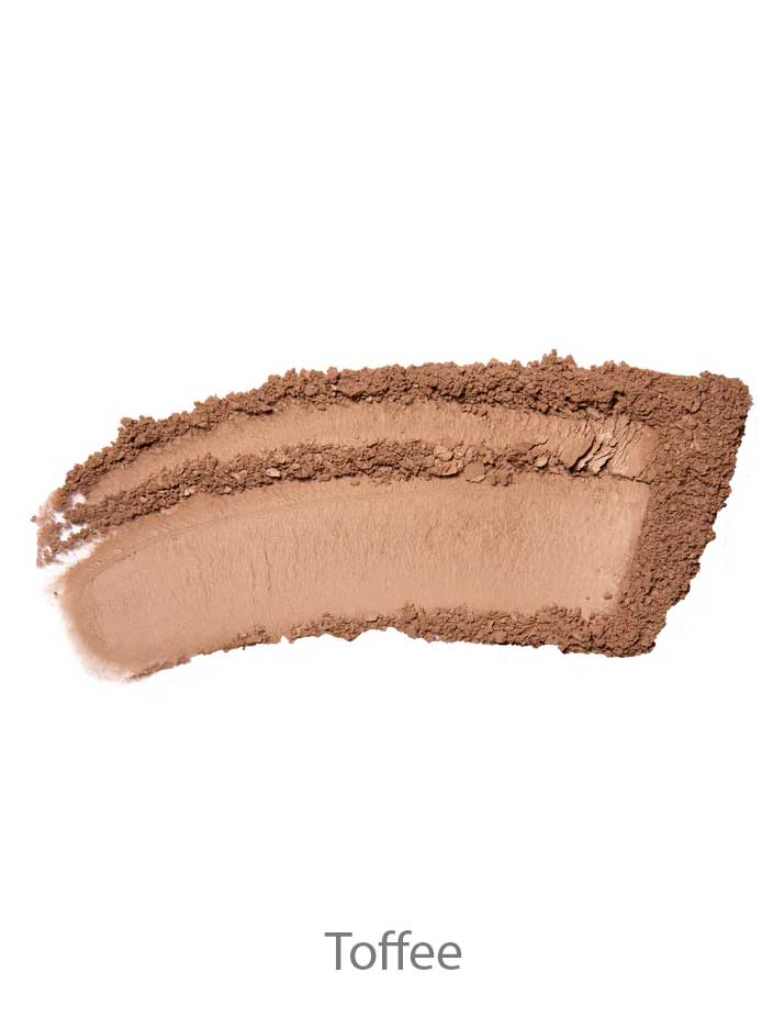 A curved smear of light brown 100% Pure Rice Powder Foundation 9g in the shade Toffee is shown on a white background.